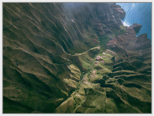Over the Edge | Aerial Odyssey over Na Pali - Living Moments Media - 3500-5500, 800-3500, Abstract, Acrylic, aerial, Artwork, beach, Best Moments, Best Sellers, black, blue, Canvas, Coast, Cove, green, Hawaii, Helicopter, Honopu Beach, horizontal, Island, Kauai, Maui, Metal, Moody, Mountains, Na Pali Coast, new arrivals, New Moments, ocean, open-edition, over-5500, Prints, rocks, sand, size-18-x-24, size-30-x-40, size-42-x-56, Surf, trail, Trees, Visual Artwork, waves