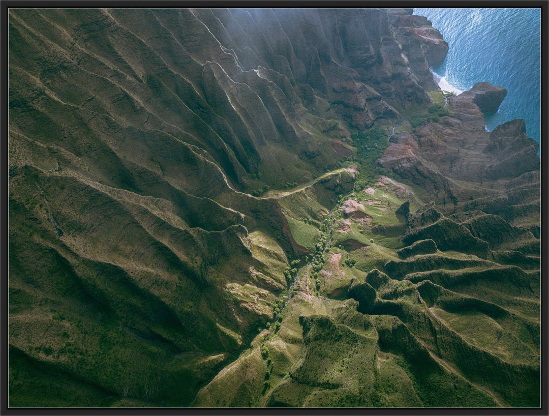 Over the Edge | Aerial Odyssey over Na Pali - Living Moments Media - 3500-5500, 800-3500, Abstract, Acrylic, aerial, Artwork, beach, Best Moments, Best Sellers, black, blue, Canvas, Coast, Cove, green, Hawaii, Helicopter, Honopu Beach, horizontal, Island, Kauai, Maui, Metal, Moody, Mountains, Na Pali Coast, new arrivals, New Moments, ocean, open-edition, over-5500, Prints, rocks, sand, size-18-x-24, size-30-x-40, size-42-x-56, Surf, trail, Trees, Visual Artwork, waves