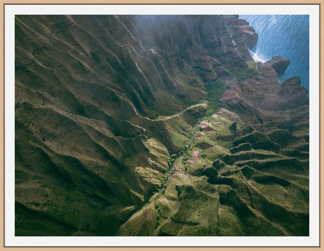 Over the Edge | Aerial Odyssey over Na Pali - Living Moments Media - 3500-5500, 800-3500, Abstract, Acrylic, aerial, Artwork, beach, Best Moments, Best Sellers, black, blue, Canvas, Coast, Cove, green, Hawaii, Helicopter, Honopu Beach, horizontal, Island, Kauai, Maui, Metal, Moody, Mountains, Na Pali Coast, new arrivals, New Moments, ocean, open-edition, over-5500, Prints, rocks, sand, size-18-x-24, size-30-x-40, size-42-x-56, Surf, trail, Trees, Visual Artwork, waves