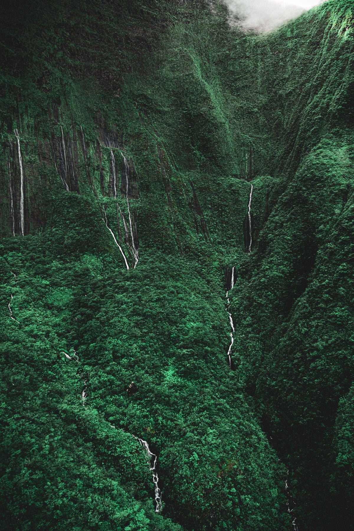 Cascading Tears by Lance Ehrecke, aerial photograph of waterfalls in the Valley of Tears in the West Maui Mountains.