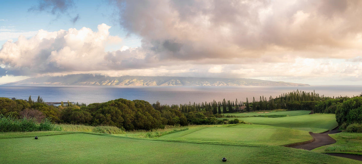 Dawn's Embrace by Lance Ehrecke, panoramic sunrise photograph of Hole 17 at Kapalua's Plantation Course.