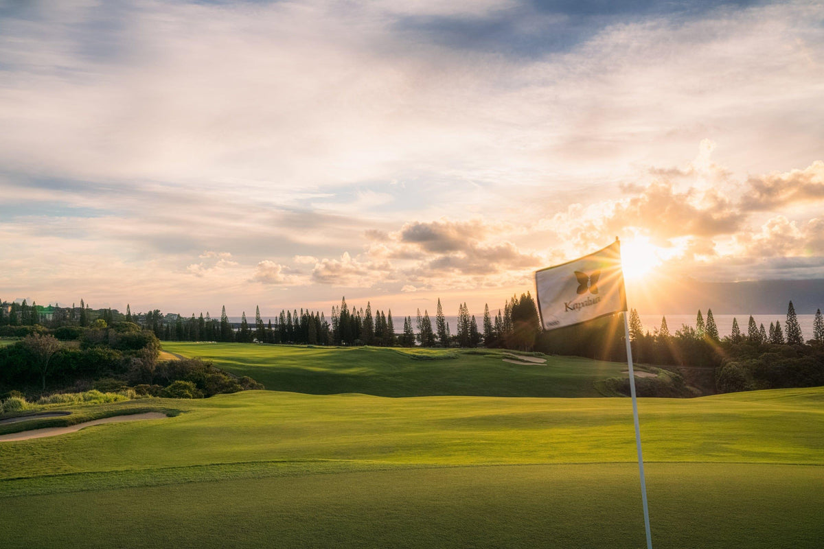 Golden Hour Glory by Lance Ehrecke, sunset photograph of Hole 18 at Kapalua's Plantation Course.