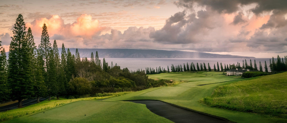 Sunrise Majesty by Lance Ehrecke, panoramic sunrise photograph of Hole 18 at Kapalua's Plantation Course.
