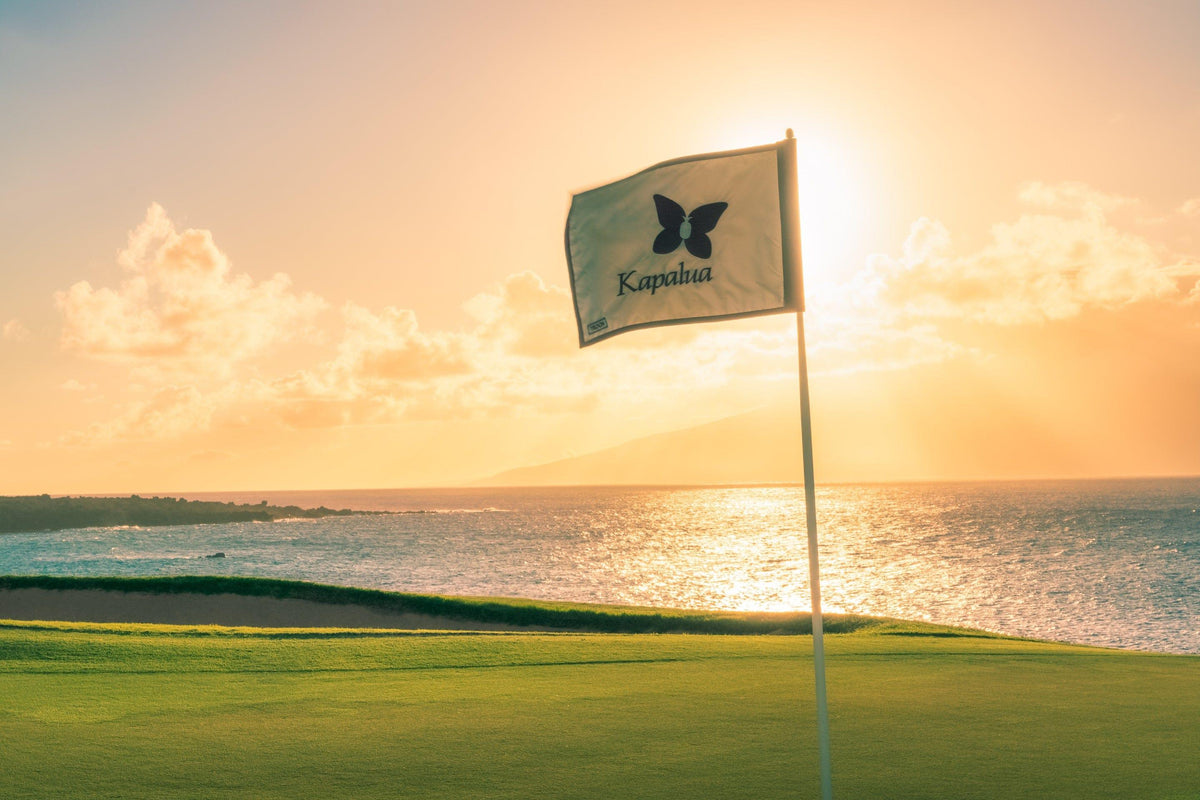 Sunset Reverie by Lance Ehrecke, sunset photograph of Hole 17 at Kapalua's Bay Course with Molokaʻi beyond.