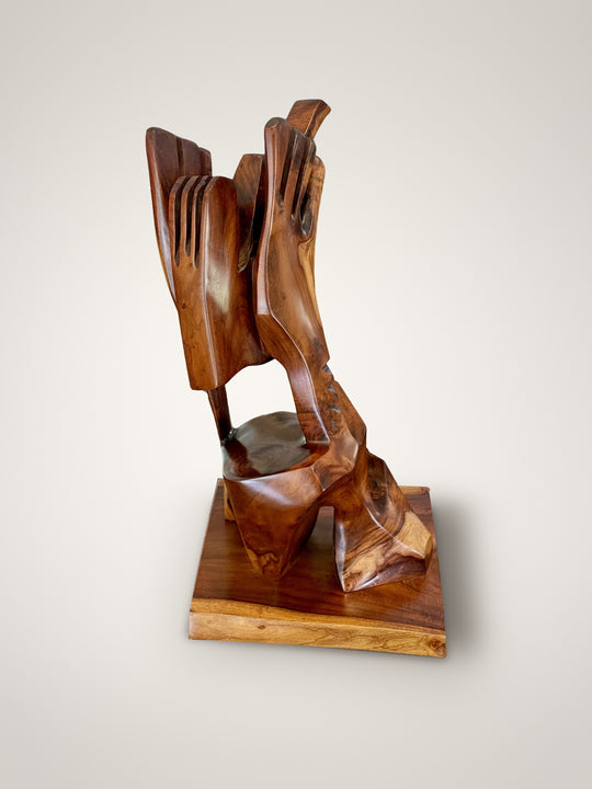 The Commoner, Milo wood sculpture by Avi Molinas: two carved hands holding a head on a square wood plinth